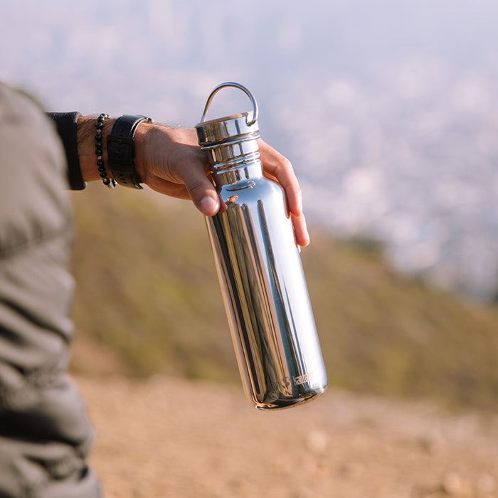 27oz-reflect-with-bamboo-cap-c9 K27SSLRF-MS-BAMBOO_reflect_bottle_hand_lifestyle.jpg