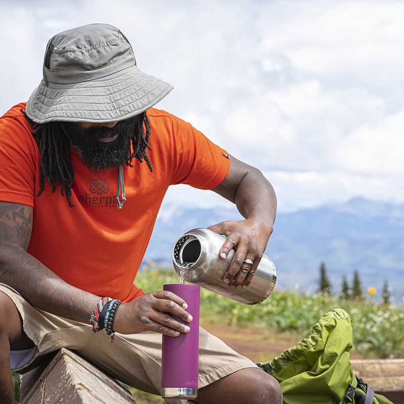 64oz-tkwide-with-loop-cap-i4 tkwide_64oz_bottle_backpacker_mountains_filling_square.jpg